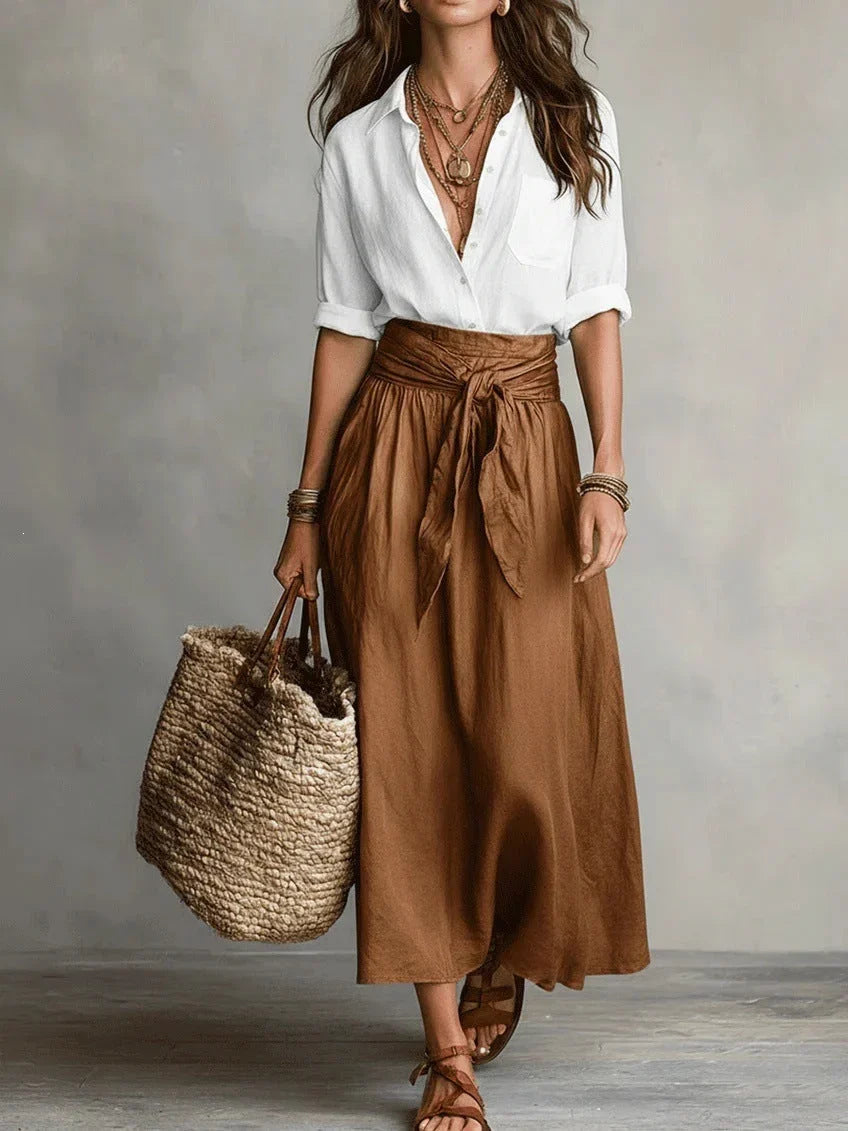 Vita - Elegante completo a due pezzi con camicetta nera e gonna midi
