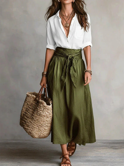 Vita - Elegante completo a due pezzi con camicetta nera e gonna midi