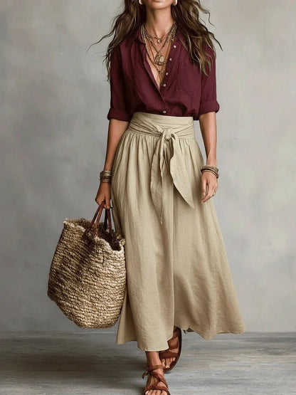 Vita - Elegante completo a due pezzi con camicetta nera e gonna midi