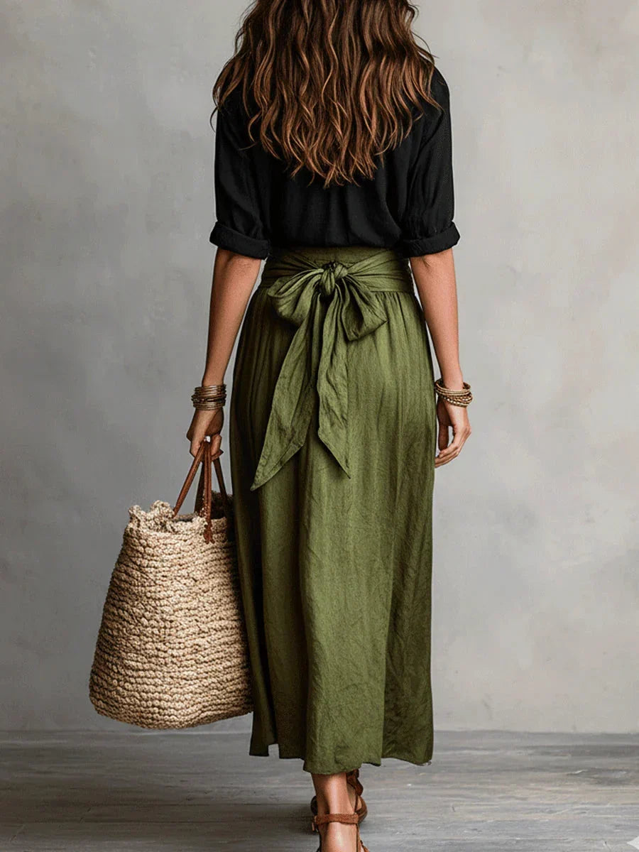 Vita - Elegante completo a due pezzi con camicetta nera e gonna midi
